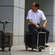 Illustration for article titled This Chinese farmer is recycling suitcases into electric scooters